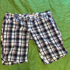 Pink plaid shorts.